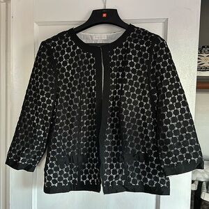 Black lace jacket with white lining.